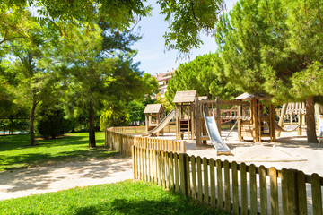 Children's wooden playground safe recreation area at public park