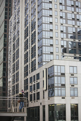 Young woman tourist on the viewpoint, admiring the view of the city.