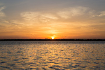 Sunset in lake at Martin Dies state park, Texas