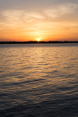 Sunset in lake at Martin Dies state park, Texas