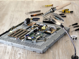 Fototapeta premium Soldering, repair and maintenance of a computer monitor. 