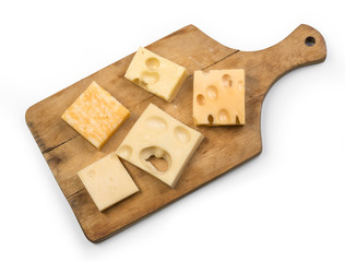 various types of cheese on wooden board
