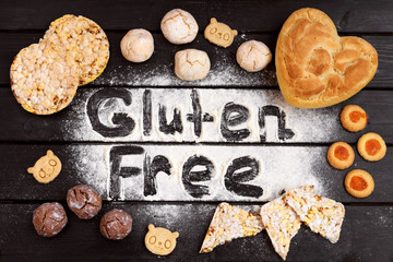 Gluten free bread on wooden background top view.