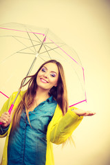 Woman in rainproof coat with umbrella. Forecasting