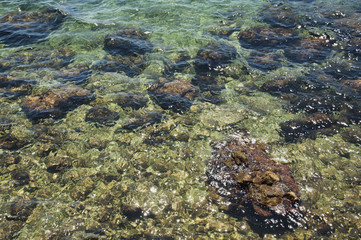 Fototapeta na wymiar stones in sea water