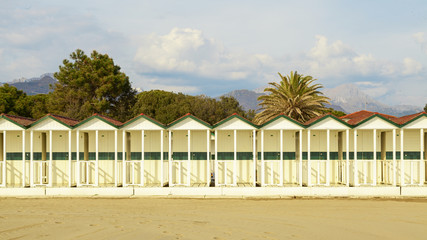 sea cabins view on versilia beach on sunset