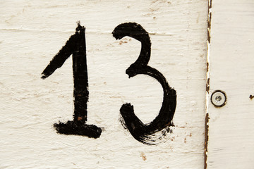 Number thirteen in wood
