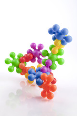 Colorful plastic toys on white background