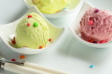 Ice cream in small forms on a white background