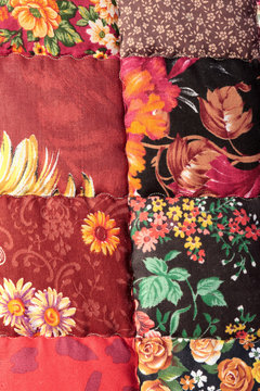 The red patchwork quilt