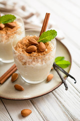Creamy rice pudding topped with cinnamon and almond