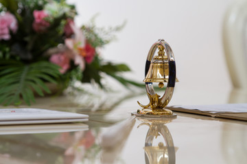 Bell decoration on the glossy table