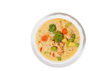  chicken soup with vegetables and cheese. top view. isolated on white