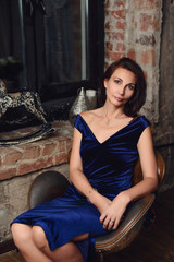 Seductive woman 50 years old posing in photo studio