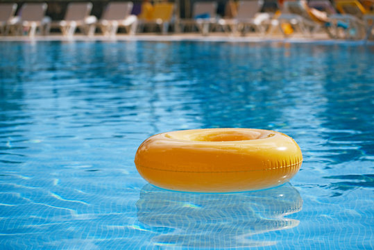 floating ring on blue water swimpool