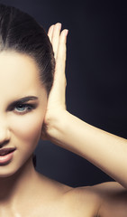 Girl with closed ear closeup