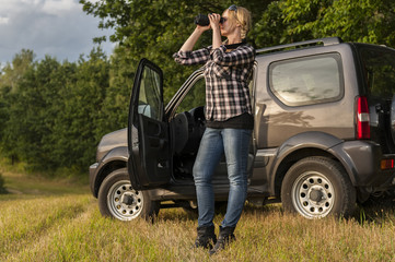 Woman looking through binoculars