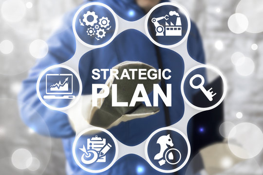 Strategic Plan Industrial Concept. Industry 4 planning and strategy. ERP enterprise strategies resource web finance manufacturing technology. Worker touched icon strategic plan word on virtual screen.