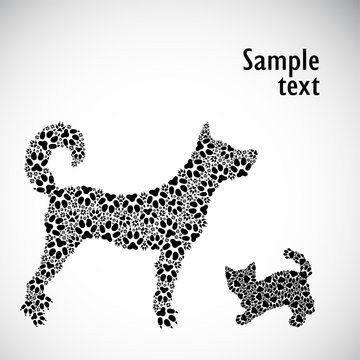 Silhouettes of kitten and dog from tracks