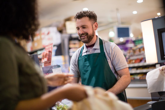 Woman at grocery checkout scan