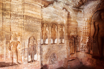 Indian rock-cut architecture. Carved wall dedicated to revered figures of Jainism inside the 7th...