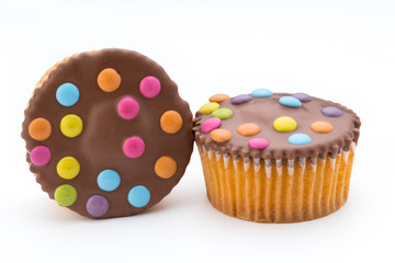 Multiple colorful decorated muffins on a white background.