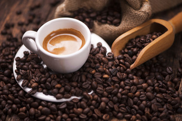 Coffee  on the coffee beans background
