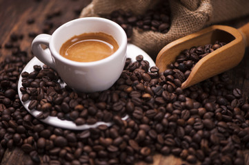 Coffee  on the coffee beans background
