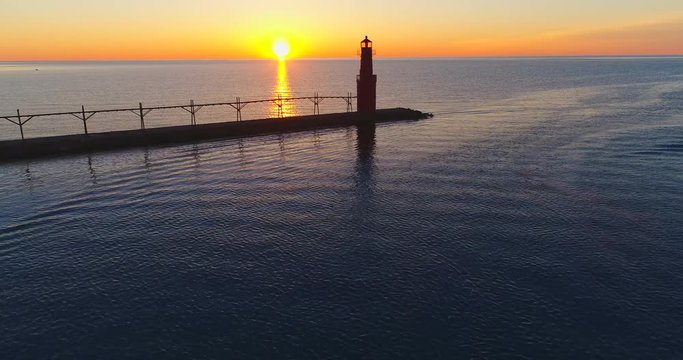 Lake Michigan at Sunrise with iconic Algoma Wisconsin Lighthouse.
