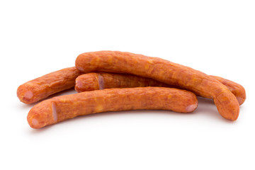 Stack of smoked sausages isolated on a white background.