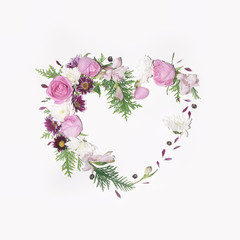 Fototapeta na wymiar Floral heart frame on white background