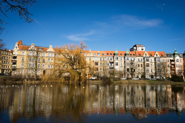 old tenement buildings by the lake