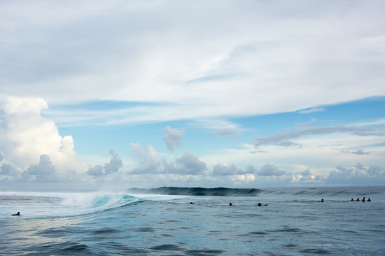 Large group of surfers floating on sea, Tahiti, South Pacific