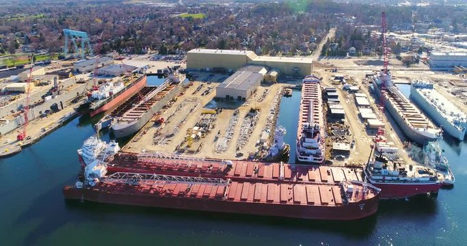 Beautiful industrial shipyard gleaming in the morning sun, aerial view.

