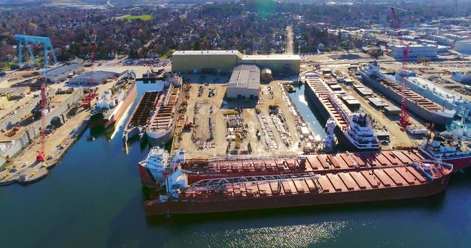 Beautiful industrial shipyard gleaming in the morning sun, aerial view.
