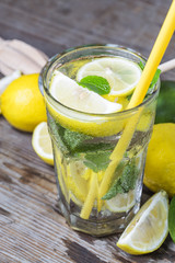 A wooden table drinks Lemon Mint
