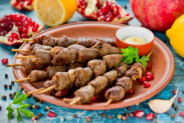 Chicken hearts skewer barbeque with pomegranate, lemon and garlic