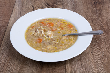 Vegetable soup on a wooden table
