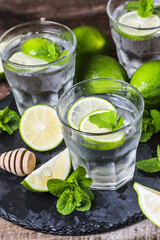 Mojito cocktail in a bur on a rustic table, selective focus