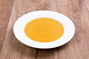 Vegetable soup on a wooden table