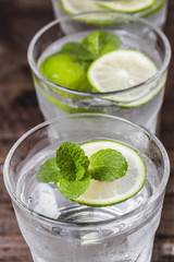 Mojito cocktail in a bur on a rustic table, selective focus