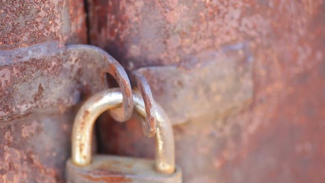 old lock on rusty gate