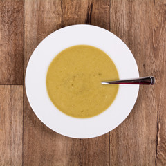 Vegetable soup on a wooden table