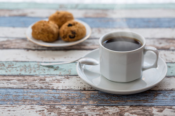 Coffee and pastries on turquoise vintage table
