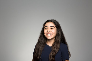 Studio portrait of an excited girl