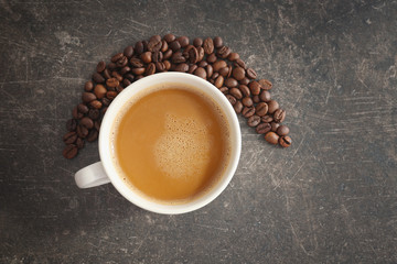 Cup of tasty butter coffee on grey background