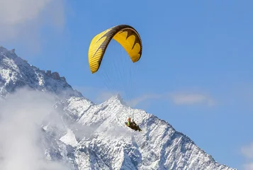 Tuinposter Paraglider flying against the mountain Lhotse (8516 m) - Everest region, Nepal, Himalayas © vadim_petrakov