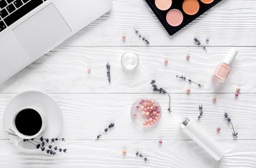 trendy woman desk with cosmetic, lavender, laptop white background top view