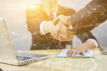 Great job,Sealing a deal,Successful business,Handshake,Businessman join together,Good agreement.two business people shaking hands standing at the working place,selective focus,Vintage ,double exposure