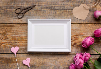 Spring design with peony flower and frame wooden background top view mock-up